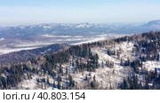 Горный Алтай зимой: хребет Иолго. Вид с воздуха. Altai mountains in winter: Iolgo Ridge. Aerial view. Стоковое видео, видеограф Евгений Романов / Фотобанк Лори