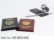 Паспорт, военный билет, телефон, кольцо, браслет и часы на белом фоне. Стоковое фото, фотограф Сергей Васильев / Фотобанк Лори