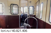 The car driver controls the retro tram car in motion. View from the tram cabin. Moscow Tram Festival in Moscow 08.07.2023. Редакционное видео, видеограф Ярославский Максим / Фотобанк Лори