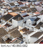 Aerial panoramic view of rooftops of white houses of Olvera town, considered the gate of white towns route in the province of Cadiz, Spain. Стоковое фото, фотограф Matej Kastelic / Фотобанк Лори