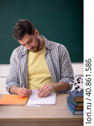 Young male physicist student in the classroom. Стоковое фото, фотограф Elnur / Фотобанк Лори