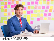 Young handsome man in conflicting priorities concept. Стоковое фото, фотограф Elnur / Фотобанк Лори