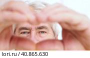 Happy Old Senior Man Making Heart Shape Hand Gesture. Look at Camera, Showing Romantic. Retired Elderly Grandparent Close Up Portrait. Symbol of Love Yourself. Doing charity Work, take Care of Health. Стоковое видео, видеограф Марина Демидюк / Фотобанк Лори