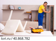 Young male carpenter stealing jewelry at home. Стоковое фото, фотограф Elnur / Фотобанк Лори