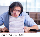 Young employee unhappy with excessive work. Стоковое фото, фотограф Elnur / Фотобанк Лори