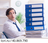 Young male employee unhappy with excessive work. Стоковое фото, фотограф Elnur / Фотобанк Лори