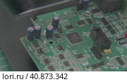 Computer board with electronic components, microcircuits, condensers, connectors, chips. Стоковое видео, видеограф Aleksey Kidisyuk / Фотобанк Лори