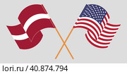 Crossed and waving flags of Latvia and the USA. Стоковая иллюстрация, иллюстратор Олег Безруков / Фотобанк Лори