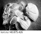 KN95 masks. Respirator, practical personal protective equipment. Several layers of the mask perfectly clean the inhaled air and effectively protect the respiratory tract from infection. Стоковое фото, фотограф Юлия Петровская / Фотобанк Лори