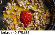 Top view of Chicken Gizzard stewed with tomato paste and vegetables in a wok. Close-up. Asian-style cooking. Стоковое фото, фотограф Воловодов Владимир / Фотобанк Лори