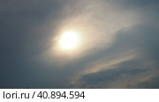 Cirrus clouds cover the disk of the sun with clouds. The disappearance of the sun behind thick dark clouds. Sunbeams in the haze. Sunset for Halloween. Weather forecast. Sky background. Стоковое видео, видеограф Юлия Петровская / Фотобанк Лори