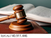 Close up of a brown wooden gavel and book. Стоковое фото, фотограф Сергей Толмачёв / Фотобанк Лори