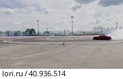Passing a turn in a drift drift by cars. Races at the Moscow Grand Prix Drift at the motorsport stadium in Kuryanovo. Russia. Moscow. 30.07.2023. Стоковое видео, видеограф Ярославский Максим / Фотобанк Лори
