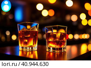 Two orange campari cocktails (Old-Fashioned Negroni Aperol Spritz) with ice on a contrast turquoise background, vertical. Light through the liquid. Top down view. Generative AI. Стоковое AI-изображение, AI-художник Sergey Grishin / Фотобанк Лори