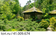 LAZAREVSKOE, SOCHI, RUSSIA - MAY, 29, 2021: Gazebos for tourists in the recreation area of Berendeevo Kingdom, Sochi. Редакционное фото, фотограф Tae Mi / Фотобанк Лори