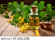 Moringa leaf and flower oil on a wooden table. Стоковое AI-изображение, AI-художник Ольга Ильина / Фотобанк Лори