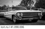 DIEDERSDORF, GERMANY - AUGUST 30, 2020: The full-size personal luxury car Cadillac Sedan de Ville (second generation), 1961. Black and white. The exhibition of "US Car Classics". Редакционное фото, фотограф Sergey Kohl / Фотобанк Лори