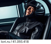 Biker in a modern helmet. Стоковое AI-изображение, AI-художник Кирилл Черезов / Фотобанк Лори