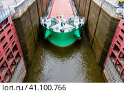 Vytegra, Russia - August 16, 2015: Cargo ship's bow entered to the White Sea-Baltic Canal Gateway. Close up image. Редакционное фото, фотограф VittoriaChe / Фотобанк Лори