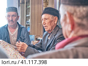 Mullah speaking sermon at home in Siberian village (2021 год). Редакционное фото, фотограф Ирина Кононова / Фотобанк Лори