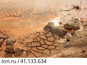Pollution of the river bed with oxides of copper ore. Стоковое фото, фотограф Юрий Бизгаймер / Фотобанк Лори