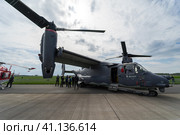 BERLIN, GERMANY - APRIL 25, 2018: V/STOL military transport aircraft Bell Boeing V-22 Osprey. US Air Force. Exhibition ILA Berlin Air Show 2018. Редакционное фото, фотограф Sergey Kohl / Фотобанк Лори