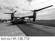 BERLIN, GERMANY - APRIL 25, 2018: V/STOL military transport aircraft Bell Boeing V-22 Osprey. US Air Force. Black and white. Exhibition ILA Berlin Air Show 2018. Редакционное фото, фотограф Sergey Kohl / Фотобанк Лори