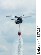 BERLIN, GERMANY - JUNE 02, 2016: Heavy-lift cargo helicopter Sikorsky CH-53 Sea Stallion of the German Army with equipment for fighting fires. Exhibition ILA Berlin Air Show 2016. Редакционное фото, фотограф Sergey Kohl / Фотобанк Лори