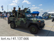 BERLIN, GERMANY - JUNE 03, 2016: Soldiers and officers of the German army (Bundeswehr) in the car. Exhibition ILA Berlin Air Show 2016. Редакционное фото, фотограф Sergey Kohl / Фотобанк Лори