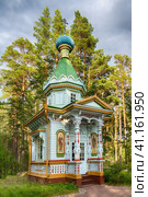 Konevets Island, Russia - 22 July 2023: Chapel of the Assumption of the Mother of God, wooden structure of 1899. Редакционное фото, фотограф Оксана Медведева / Фотобанк Лори