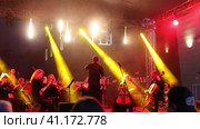 Concert of the symphony orchestra under bright scenic spotlights. Редакционное видео, видеограф Евгений Ткачёв / Фотобанк Лори