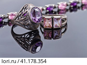 Carved silver ring with a blue gem and a silver bracelet. Стоковое фото, фотограф Сергей Сергеев / Фотобанк Лори
