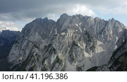 Aerial circle fly around Dachstein top summit mountain top located near Hinterer Gosausee lake Upper. Стоковое фото, фотограф Igor Tichonow / Фотобанк Лори