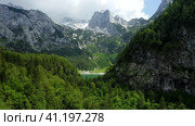 Aerial fly towards Dachstein mountain and Hinterer Gosausee lake in Upper Austria. Стоковое фото, фотограф Igor Tichonow / Фотобанк Лори