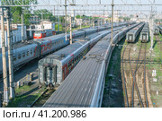 Passenger cars at the marshalling yard. Railway transport. Transport railway interchange. Rails and sleepers. Transportation of people by rail. Стоковое фото, фотограф Эдуард Белкин / Фотобанк Лори