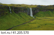 Aerial Drone footage of Iceland's impressive Selijalandfoss waterfall. Стоковое видео, видеограф Igor Tichonow / Фотобанк Лори