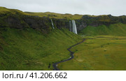 Seljalandfoss waterfall Iceland aerial view 4K summertime. Стоковое видео, видеограф Igor Tichonow / Фотобанк Лори
