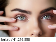 Woman's Eye with Hand Close Up. Стоковое AI-изображение, AI-художник Поликарпов Владимир Владимирович / Фотобанк Лори