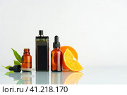 Vape liquid with orange flavor on white background. Стоковое фото, фотограф Сергей Толмачёв / Фотобанк Лори