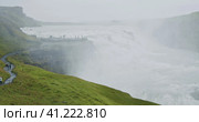 Gullfoss waterfall and silhouette of tourist standing on view platform. Icelandic panoramic landscap. Стоковое фото, фотограф Igor Tichonow / Фотобанк Лори