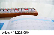 The boy is engaged in abacus, mental arithmetic for children. Стоковое видео, видеограф Igor Skripachev / Фотобанк Лори