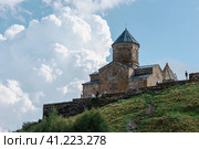 Trinity Church of Gergeti near Mount Kazbek in the Caucasus. Kazbegi. Georgia. 06.09.23 (2023 год). Редакционное фото, фотограф Ярославский Максим / Фотобанк Лори