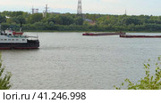 Nizhny Novgorod, Russia, 08.13.2023. Navigation on the river in summer. There is a barge on the river. Нижний Новгород, Россия, 13.08.2023. Навигация по реке летом. На реке стоит баржа. (2021 год). Редакционное видео, видеограф Egor Sarantstv / Фотобанк Лори