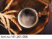 Close up of kvass traditional drink made from fermented bread in a glass on the table top view. Стоковое фото, фотограф Елена Руй / Фотобанк Лори
