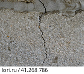 A crack in the concrete wall. The destruction of the wall from the gray blocks. Стоковое фото, фотограф Леонид Еремейчук / Фотобанк Лори