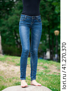 Front view of a long women legs posing with jeans. Стоковое фото, фотограф Андрей Аркуша / Фотобанк Лори