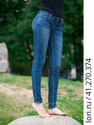 Front view of a long women legs posing with jeans. Стоковое фото, фотограф Андрей Аркуша / Фотобанк Лори