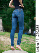 Back view of a long women legs posing with jeans. Стоковое фото, фотограф Андрей Аркуша / Фотобанк Лори