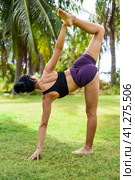 sugarcane pose or ardha chandra chapasana yoga with ukrainian woman making it outdoors. Стоковое фото, фотограф Татьяна Терехина / Фотобанк Лори