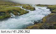 Cascades of Foss waterfall with blue water in Iceland. Стоковое видео, видеограф Igor Tichonow / Фотобанк Лори